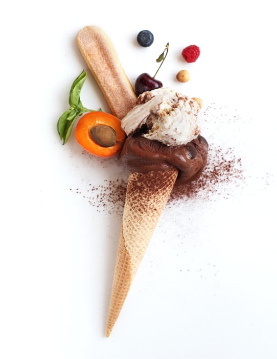 Flat lay photo of chocolate ice cream cone and ingredients