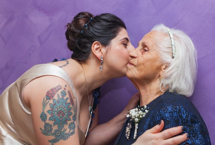 juxtaposition of a tattooed lady and her grandmother