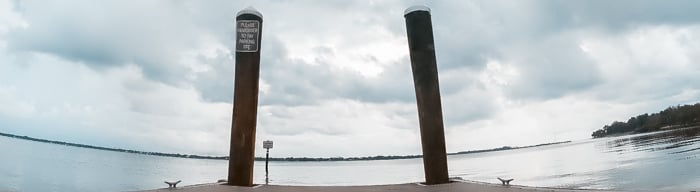 A dock with the horizon in the background, viewed from a low angle.