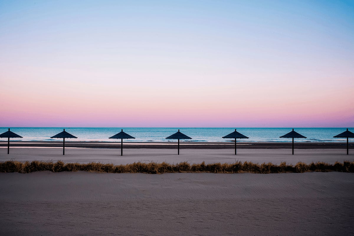 Symmetrical beach umbrellas showing visual weight