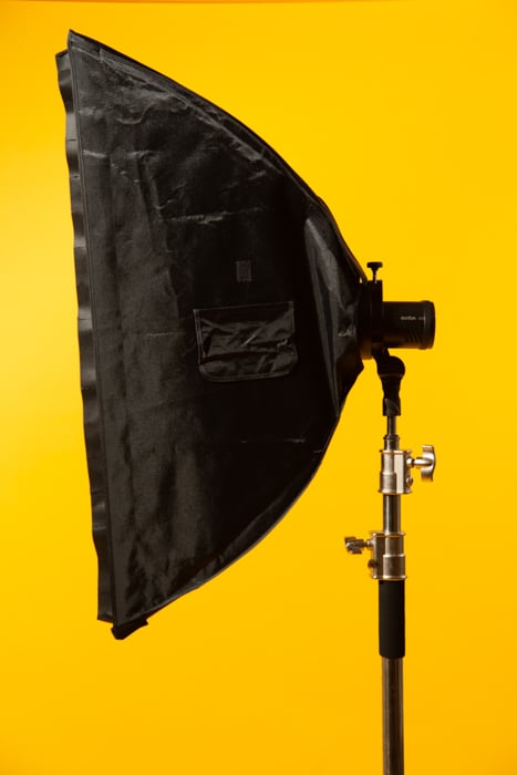 Stripbox against a yellow background