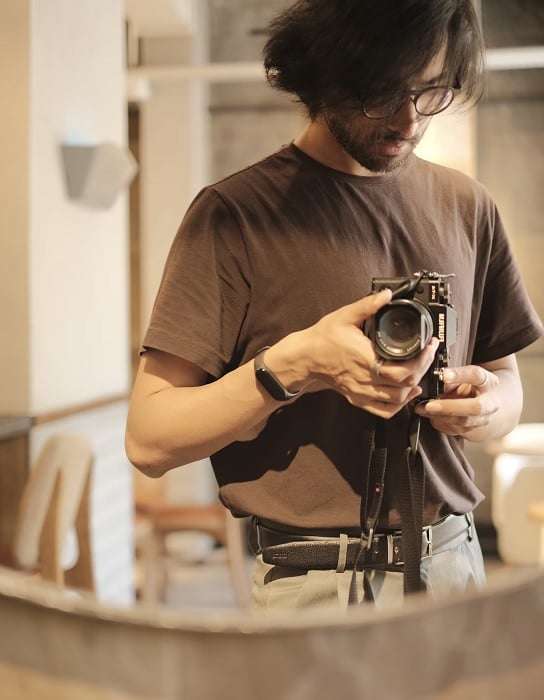 Man taking a picture of himself in the mirror