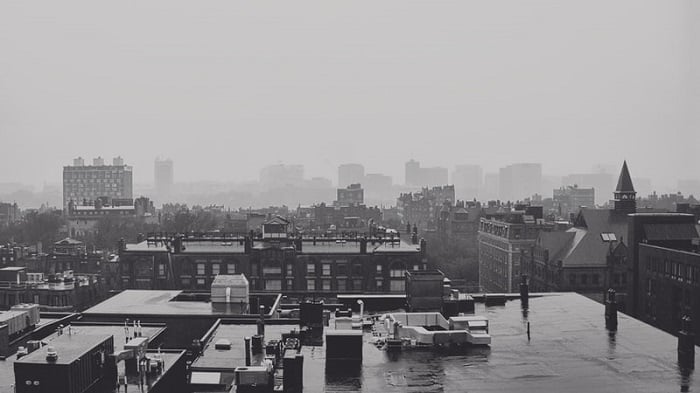 a black and white shot taken from a rooftop viewpoint