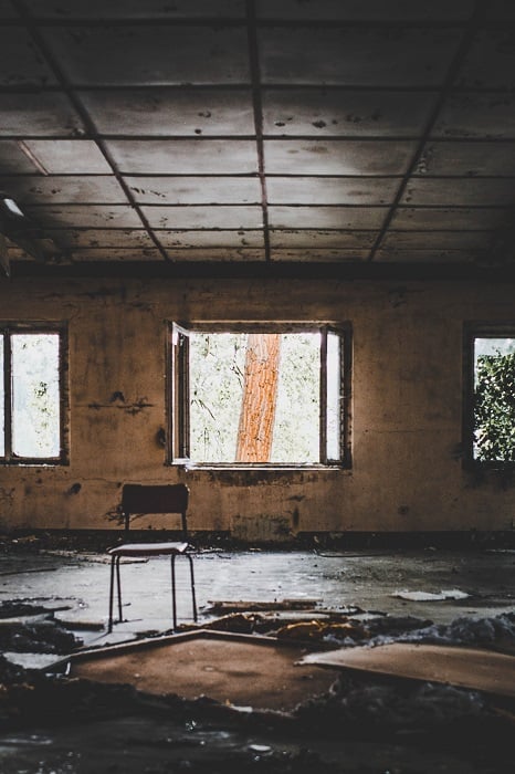 barren and damaged room in an abandoned building