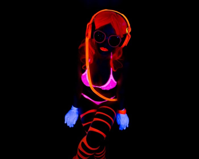 black light photography tips: a woman in an ultraviolet bikini shot in black light