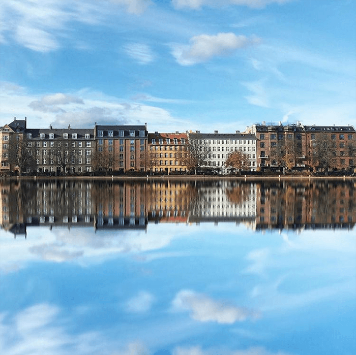 cityscape photography: Building, cloud, and blue sky reflections in Copenhagen Denmark