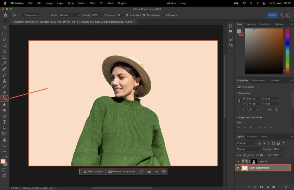 A woman wearing a green jumper and a hat in a graphic design software.