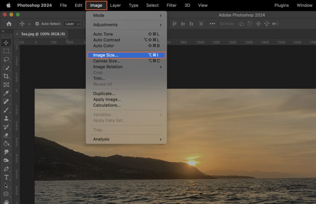 An Adobe Photoshop interface with the Edit tab selected, displaying an ocean sunset.