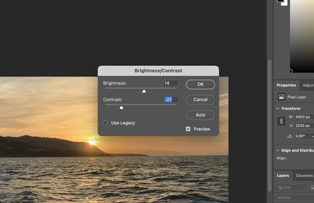 A digital photo editing software interface, with the bright sky background visible in a zoomed-in section.