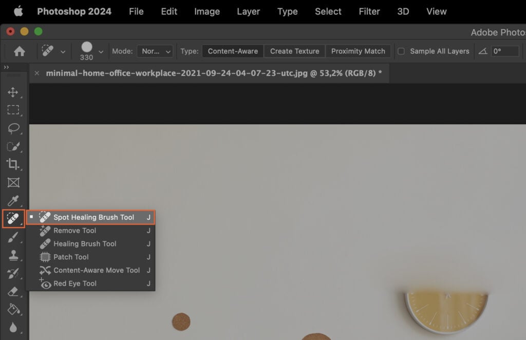 Photoshop open, showcasing the tools panel and a blurred photo in the main area.