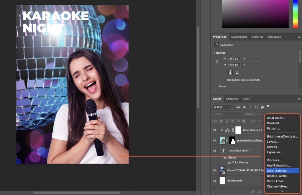 A woman with a microphone in front of her, holding it to her mouth, in front of disco lights.