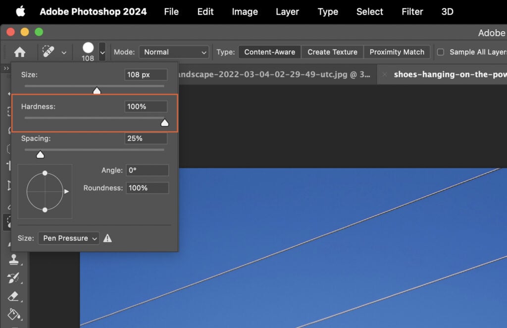 Adobe Photoshop application open, displaying a sky and clouds scene.