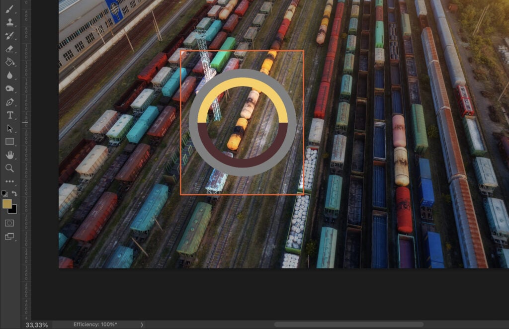 A train yard with various train cars and tracks, overlaid with a grid guide to help align elements in the picture. 