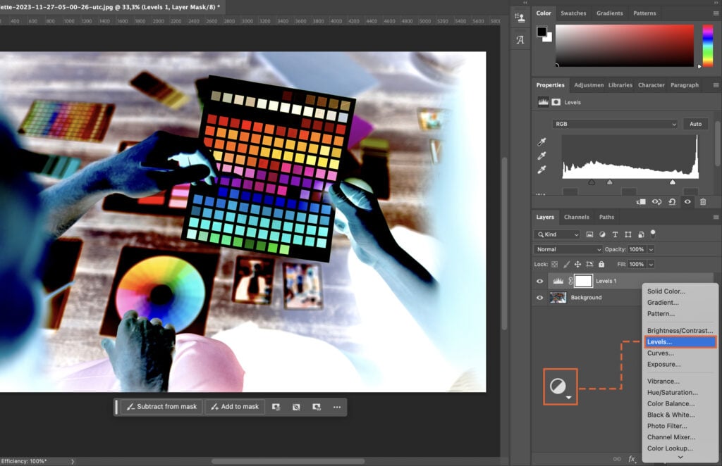 A woman holding a colorful palette, next to a man in a lab coat and a microscope.