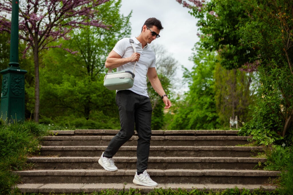 Nomatic Luma Camera Sling 9L in use by a tall man in nature