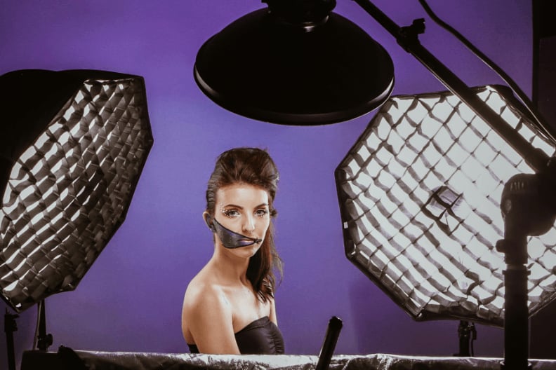 A studio portrait lighting setup with multiple lights