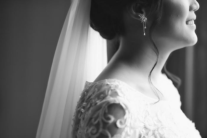 Black and white photo of woman in wedding dress
