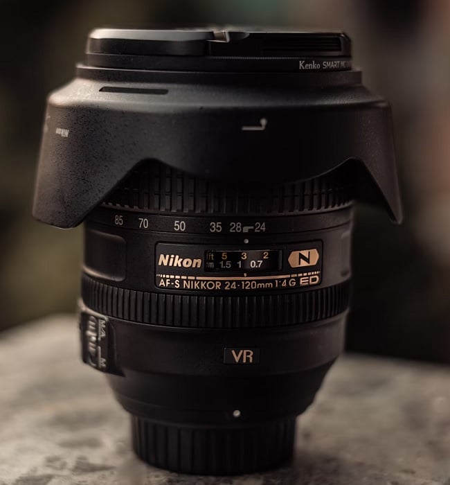 Nikon lens standing upright on a table