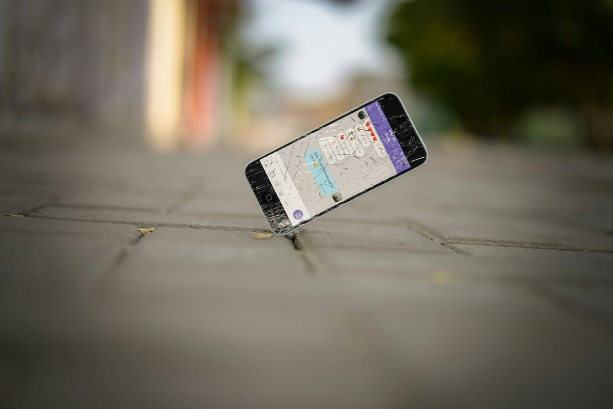 photo of smartphone dropped on ground broken