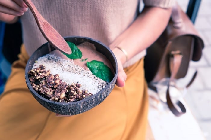 Stock photo of Woman holding an Acai bowl