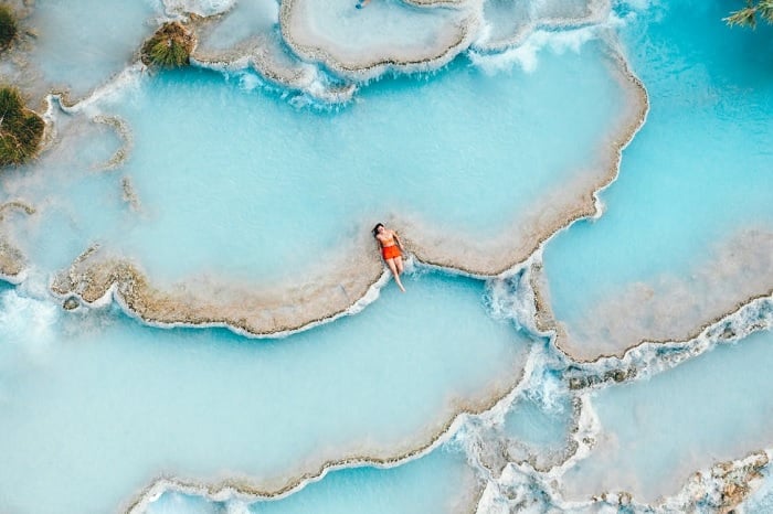 Aerial image of bikini-clad women in a coastal lagoon