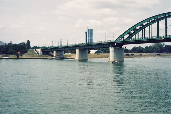 Image of iron bridge across a river with low color contrast