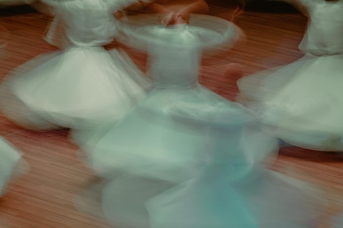 dancers spinning with motion blur photography