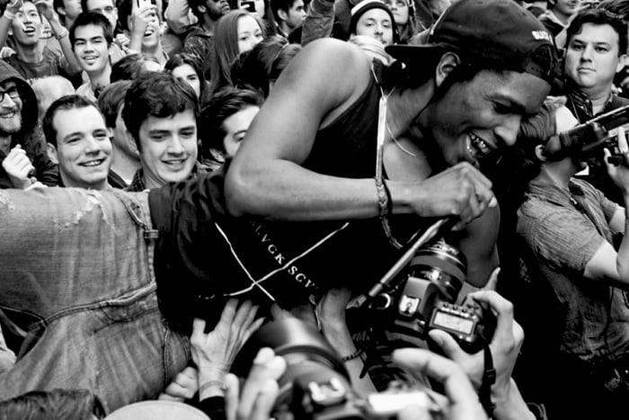 Singer crowd surfing while singing