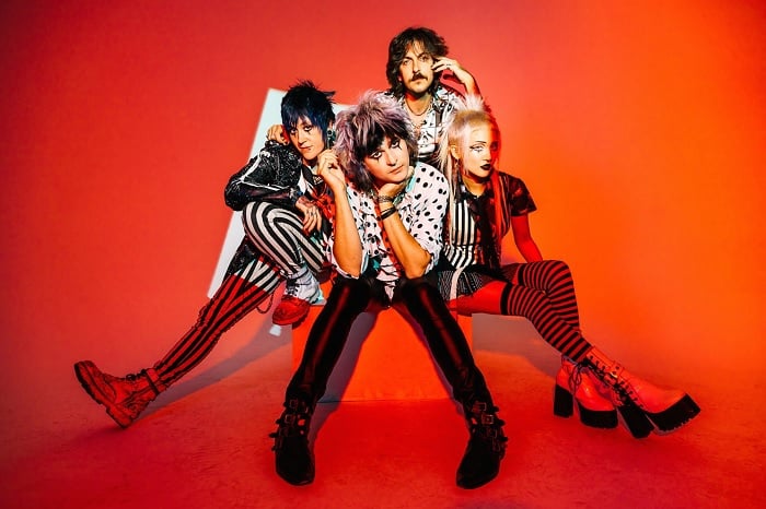 Band portrait against orange background