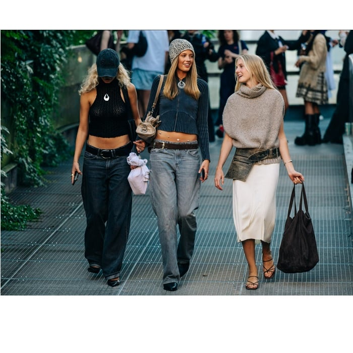 Three young blond women walking together