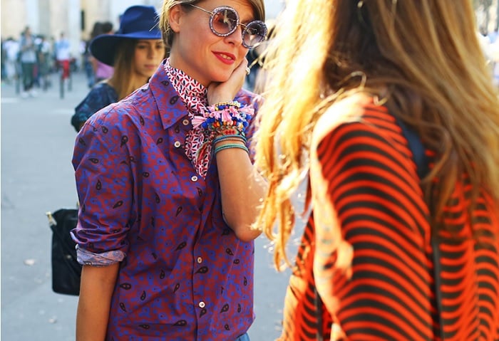 Two women talking to each other in the street