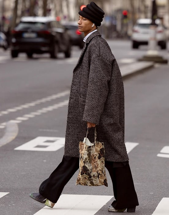 Man in fashionista clothes crossing the street