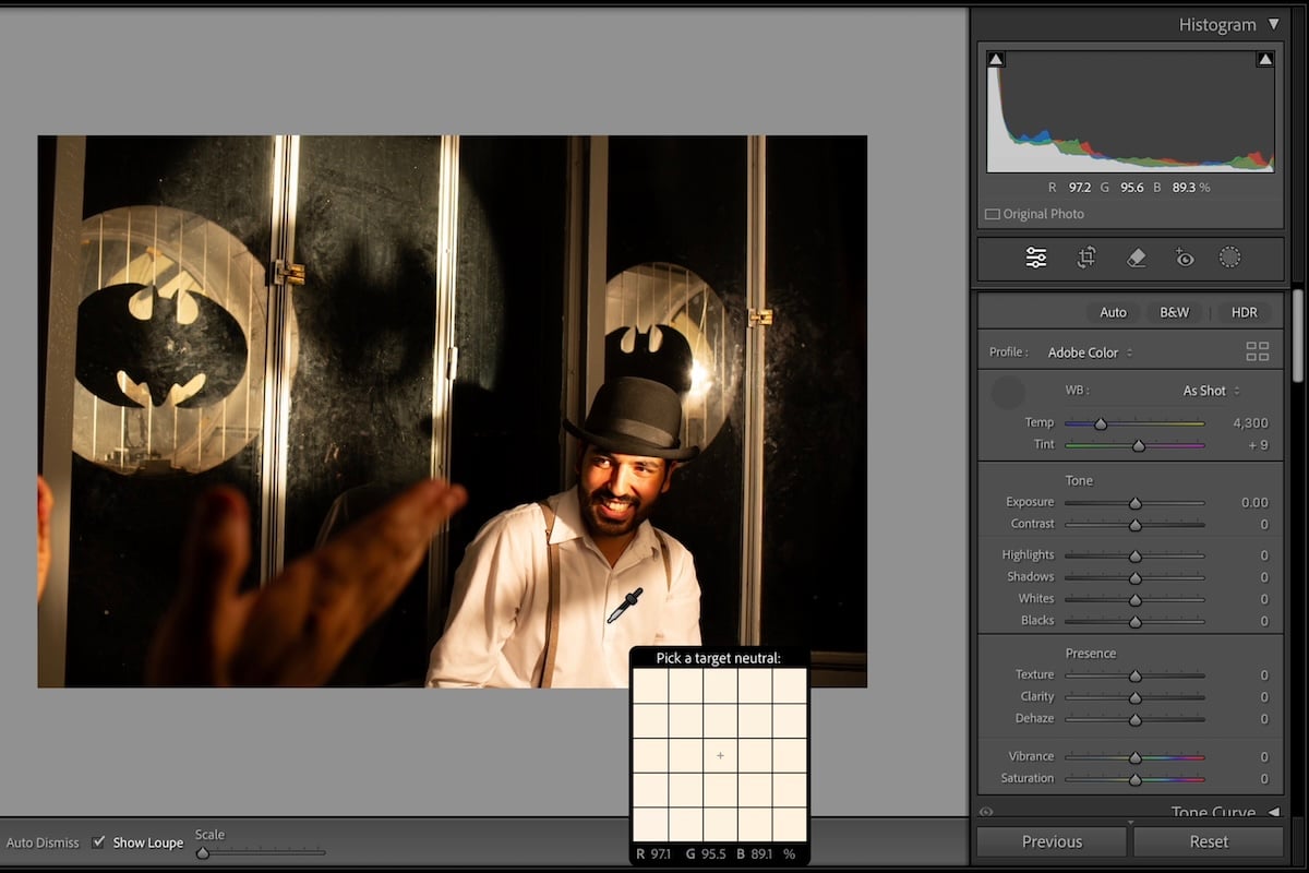 choose a neutral color on a picture of man on stage with bowler hat