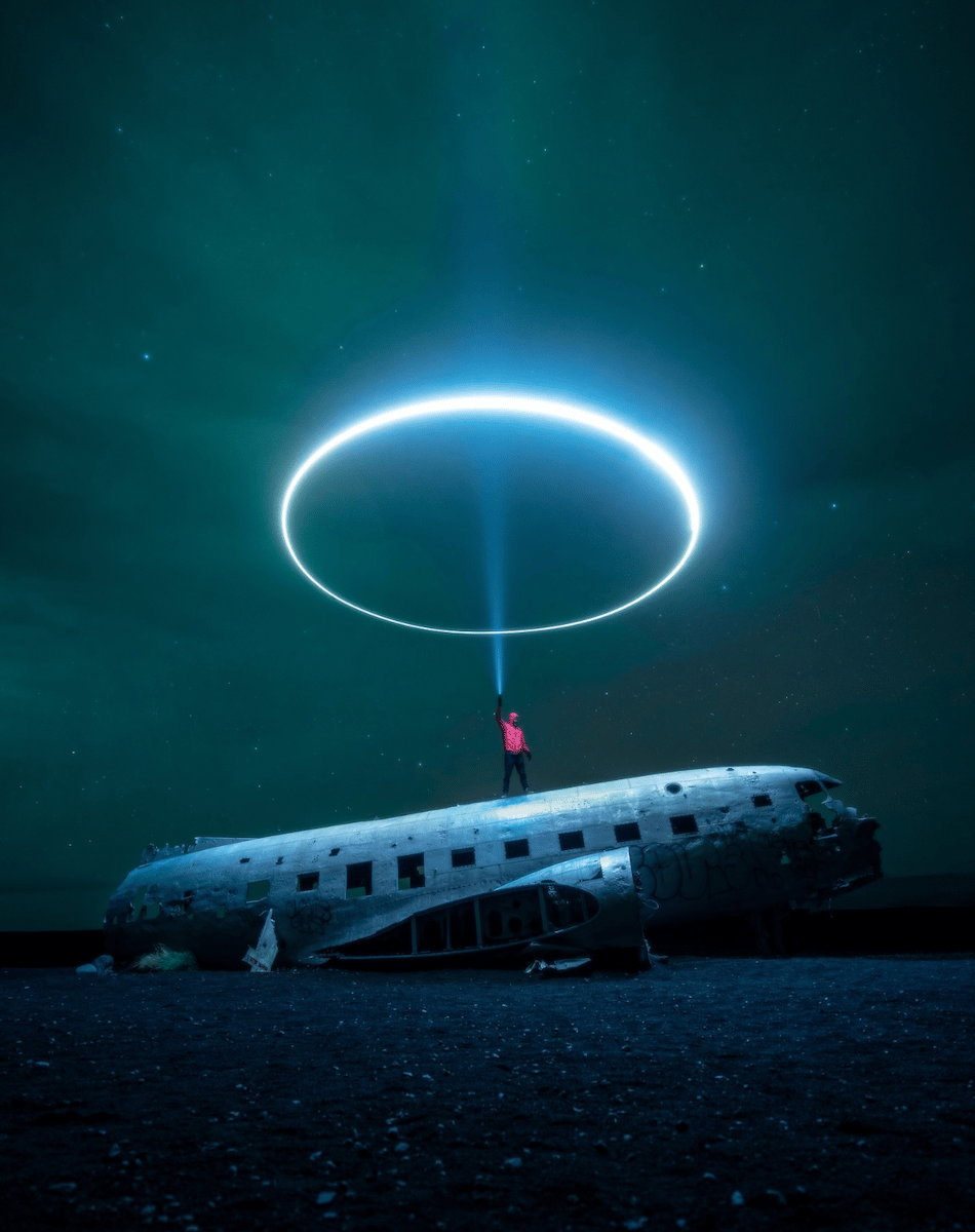 photo of person on abandoned plane with a light around then
