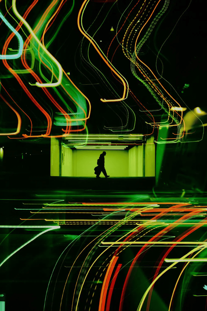 light trails photograph of man at night 
