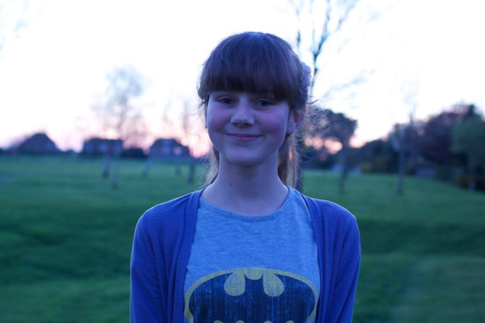 A portrait of a young girl posing out ofdoors,