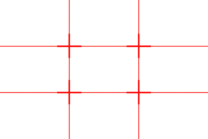 Uma grade vermelha mostrando a regra dos terços da grade (duas linhas horizontais e duas linhas verticais)