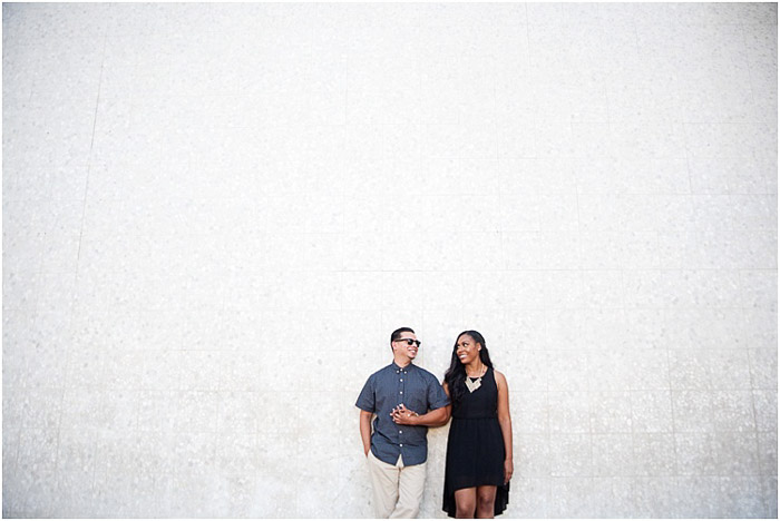 A spacious engagement photography diptych of the couple standing against a wall