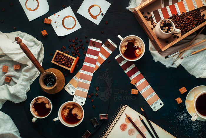 Overhead shot of coffee paraphernalia on dark background - still life photography ideas.