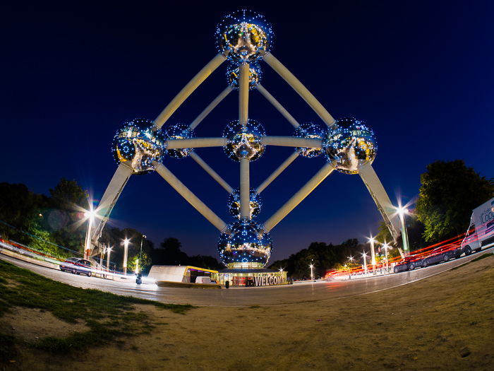 Streams of light trails from traffic passing under Brussels' most iconic landmark' most iconic landmark