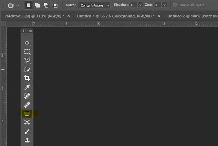 Captura de tela da interface do Photoshop com a ferramenta Patch destacada em amarelo.