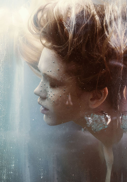 Dreamy underwater portrait of a female model