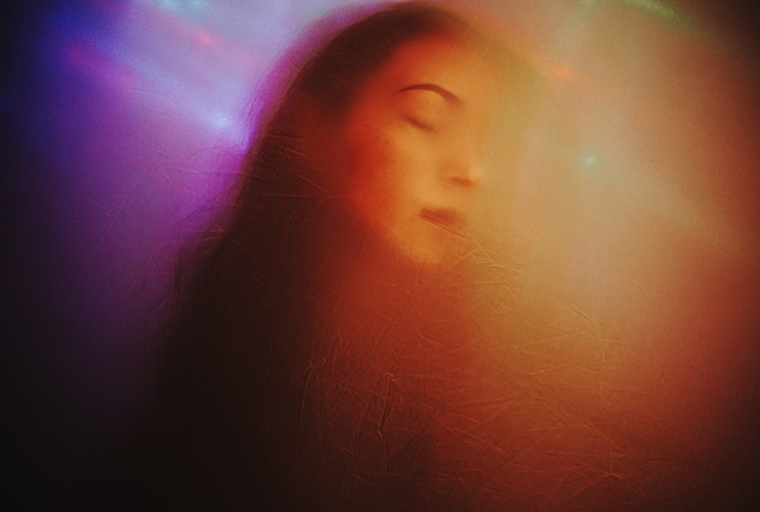 Surreal portrait photo of a woman with a blurry effect