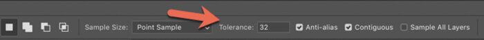 A red arrow pointing to the Tolerance selection on Photoshop options bar