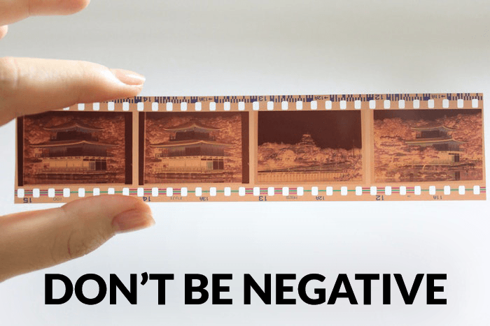 Photographer joke over a photo of a person holding a roll of negative