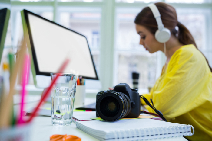 A girl editing photos at a desk